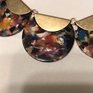 New, Multi-colored resin disk and gold necklace.
